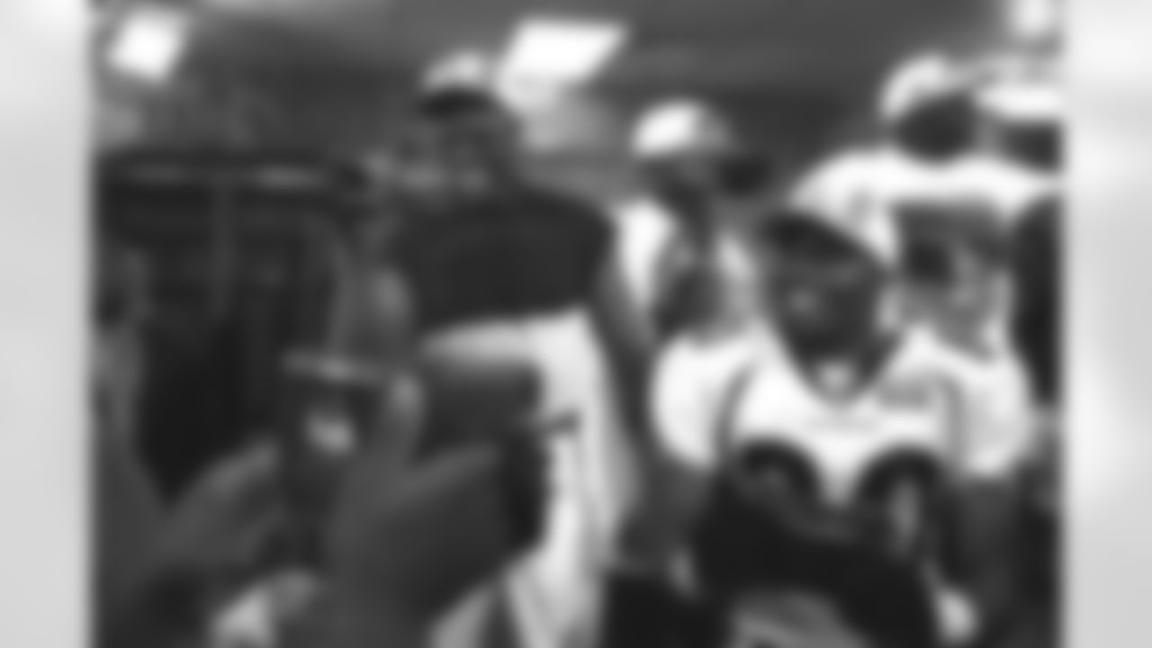 Tyrone Braxton video tapes the locker room celebration after the Super Bowl victory against the Atlanta Falcons at Pro Player Stadium in Miami, FL on January 31, 1999.