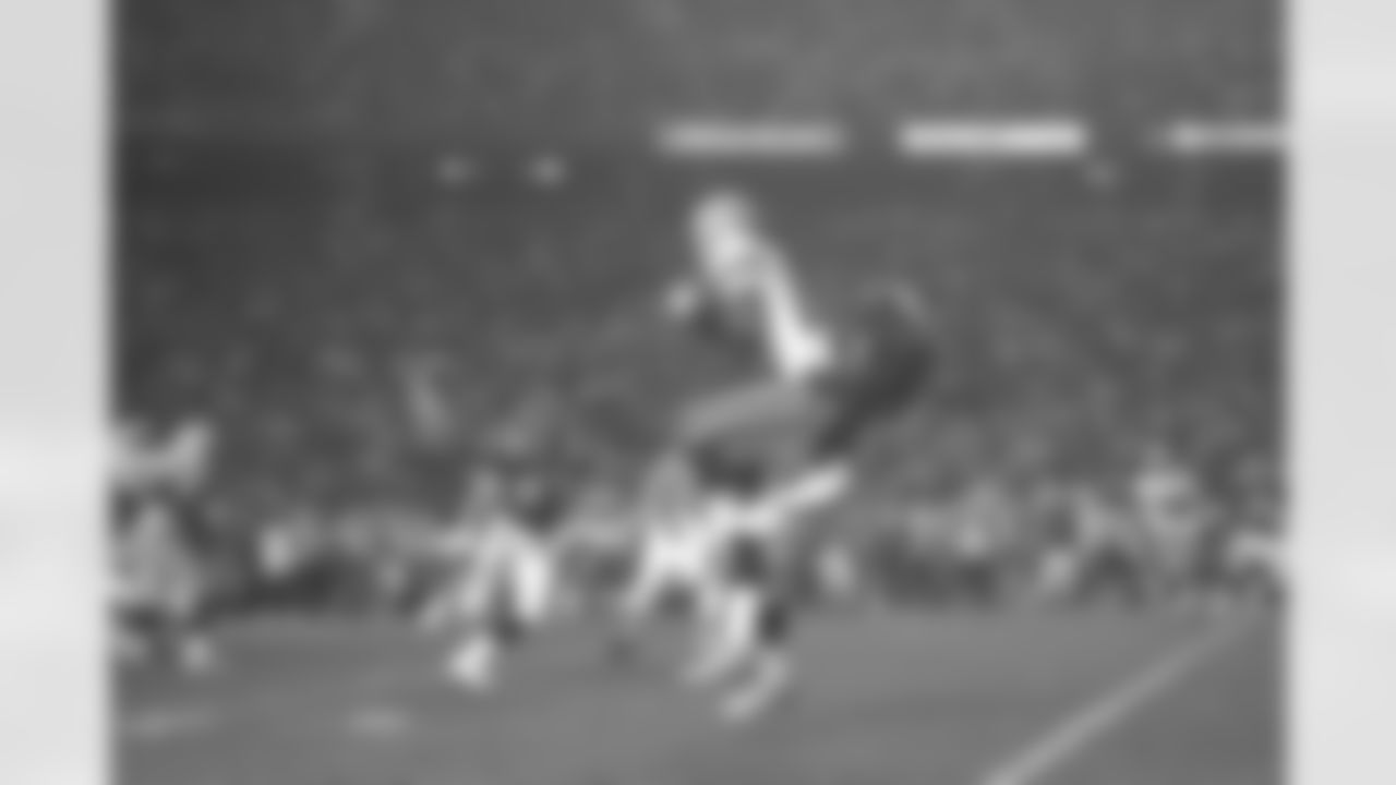 San Diego - Darrius Johnson tackles Antonio Freeman after 6 yard pass to the 15 yard line. The Packers were unable to convert on a 3rd and 6 and were forced to punt, giving the Broncos great field position for their last scoring drive of the night against the Green Bay Packers at Qualcomm Stadium in San Diego, CA on January 25, 1998.