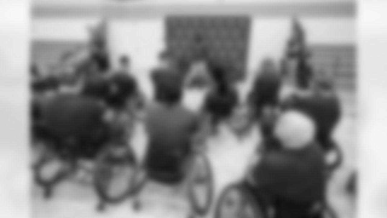 TAMPA, FL - September 08, 2021 - Buccaneers Legend Dexter Jackson presents the Buccaneers Wheelchair Football Team with new equipment before a practice at All People's Life Center. Photo By Kyle Zedaker/Tampa Bay Buccaneers