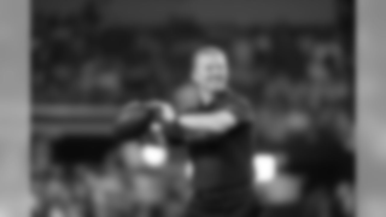 Dallas Cowboys head coach Jason Garrett throws the ball as he team warms up before an NFL football game against the Detroit Lions on Monday, Dec. 26, 2016, in Arlington, Texas. (AP Photo/Roger Steinman)