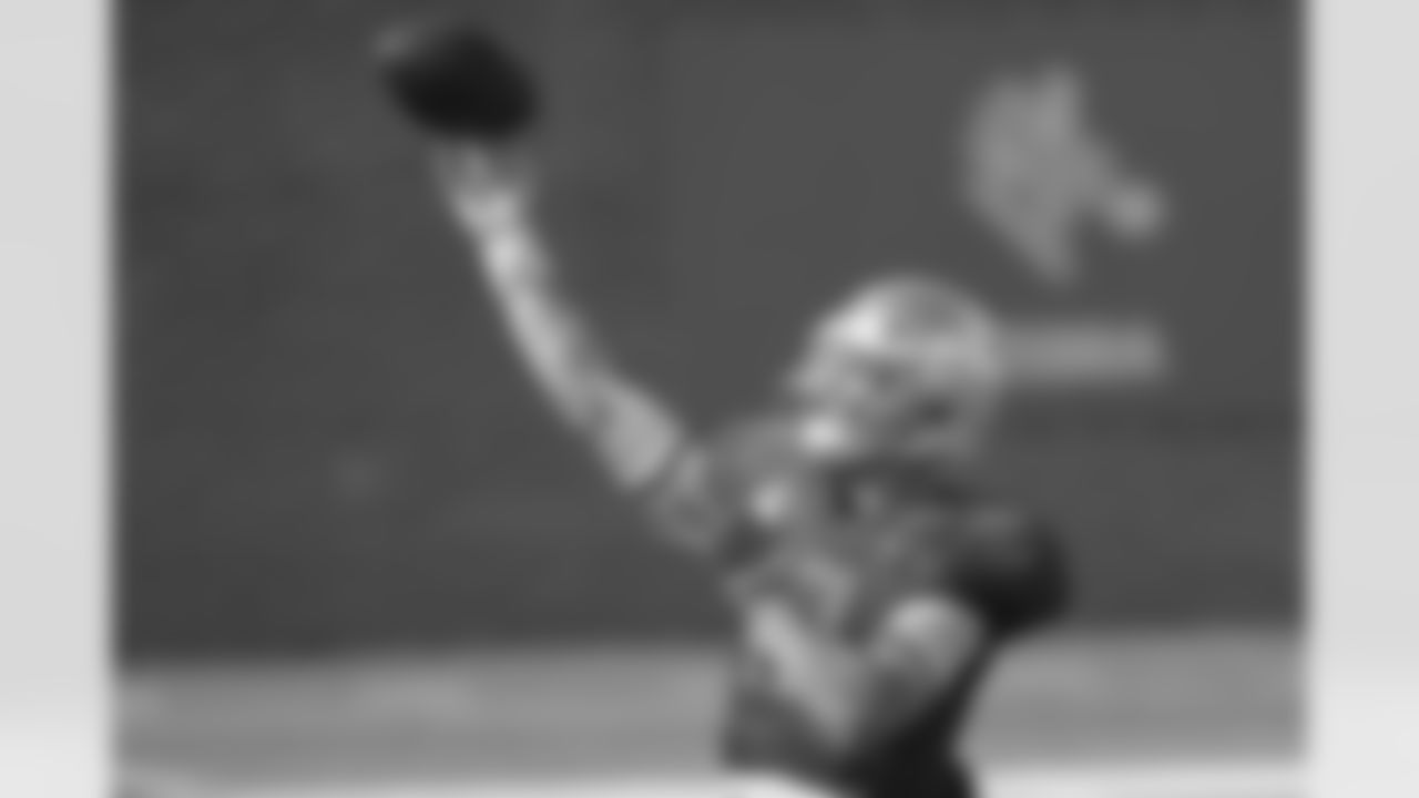 National Team quarterback Ian Book of Notre Dame (12) throws during the National Team practice for the NCAA Senior Bowl college football game in Mobile, Ala. Wednesday, Jan. 27, 2021. (AP Photo/Matthew Hinton)