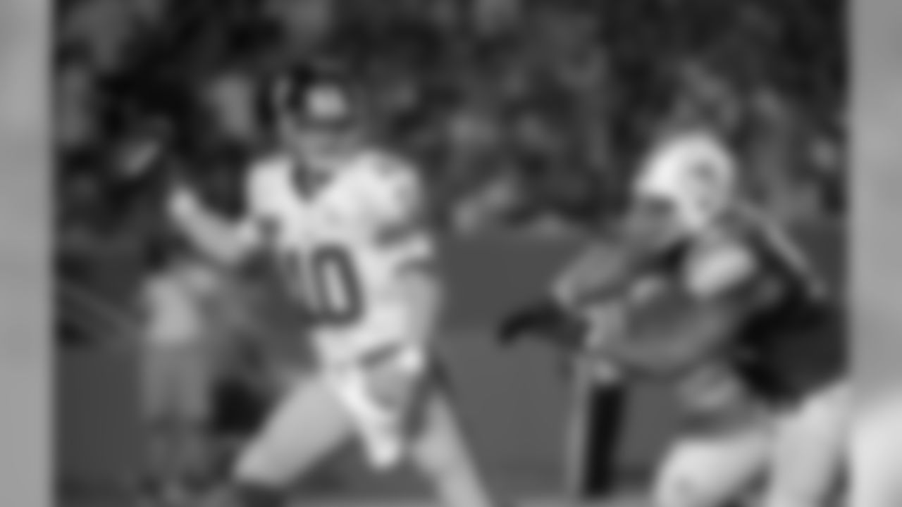 New York Giants quarterback Eli Manning (10) throws a pass under pressure from Miami Dolphins defensive tackle Ndamukong Suh (93) during an NFL football game against the Miami Dolphins on Monday, Dec. 14, 2015 in Miami Gardens, Fla. The Giants defeated the Dolphins 31-24. (Kirby Lee/NFL)