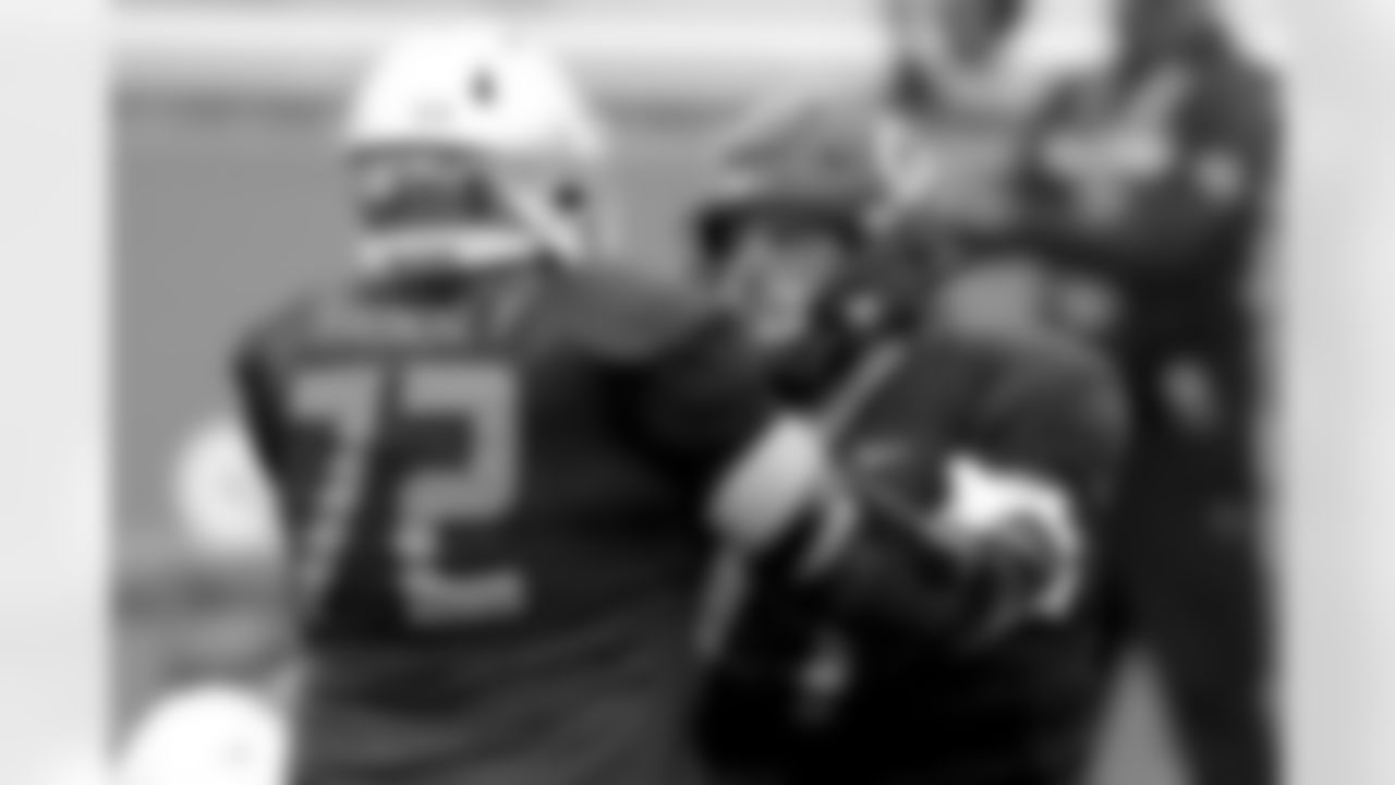 National Team offensive lineman Robert Hainsey of Notre Dame (72) and offensive lineman Jake Curhan of California (77) run a drill during the National team practice for the NCAA college Senior Bowl in Mobile, Ala., Wednesday, Jan. 27, 2021. (AP Photo/Rusty Costanza)