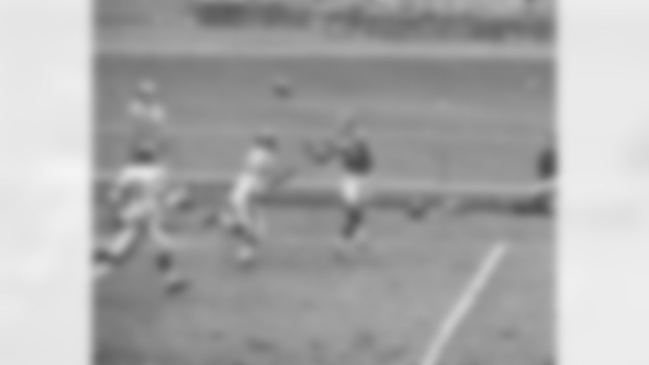 New York Giant end Del Shofner (85) has his eyes on the ball and his hands ready to catch a fourth quarter Charley Conerly pass, top left, as Los Angeles Ram Alvin Hall (46) appears to be outrun. All the giants passes weren't in vain. Conerly completed two for touchdowns in the fourth quarter to give giants a 24-14 win at Yankee stadium in New York on Oct. 22, 1961. It was giants first win at home this season. (AP Photo)