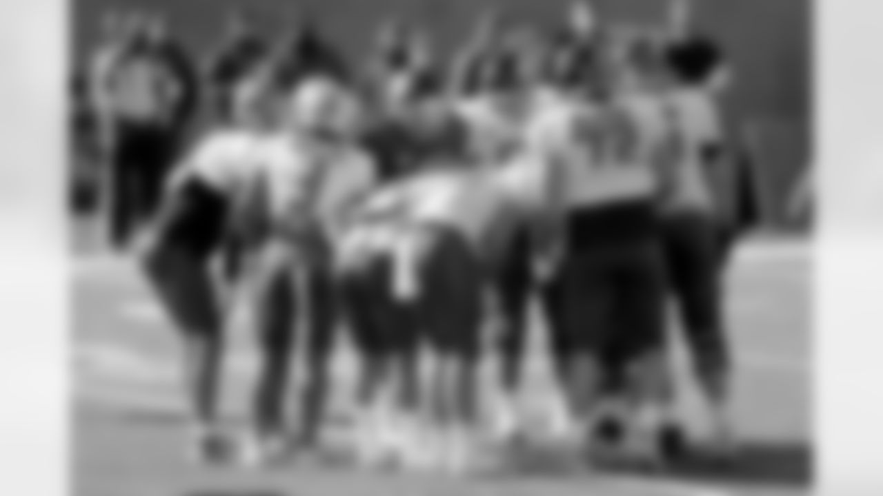 Quarterback Kellen Mond of Texas A&M (12) calls a play in the huddle during the American team practice for the NCAA college football Senior Bowl in Mobile, Ala, Thursday, Jan. 28, 2021. (AP Photo/Rusty Costanza)