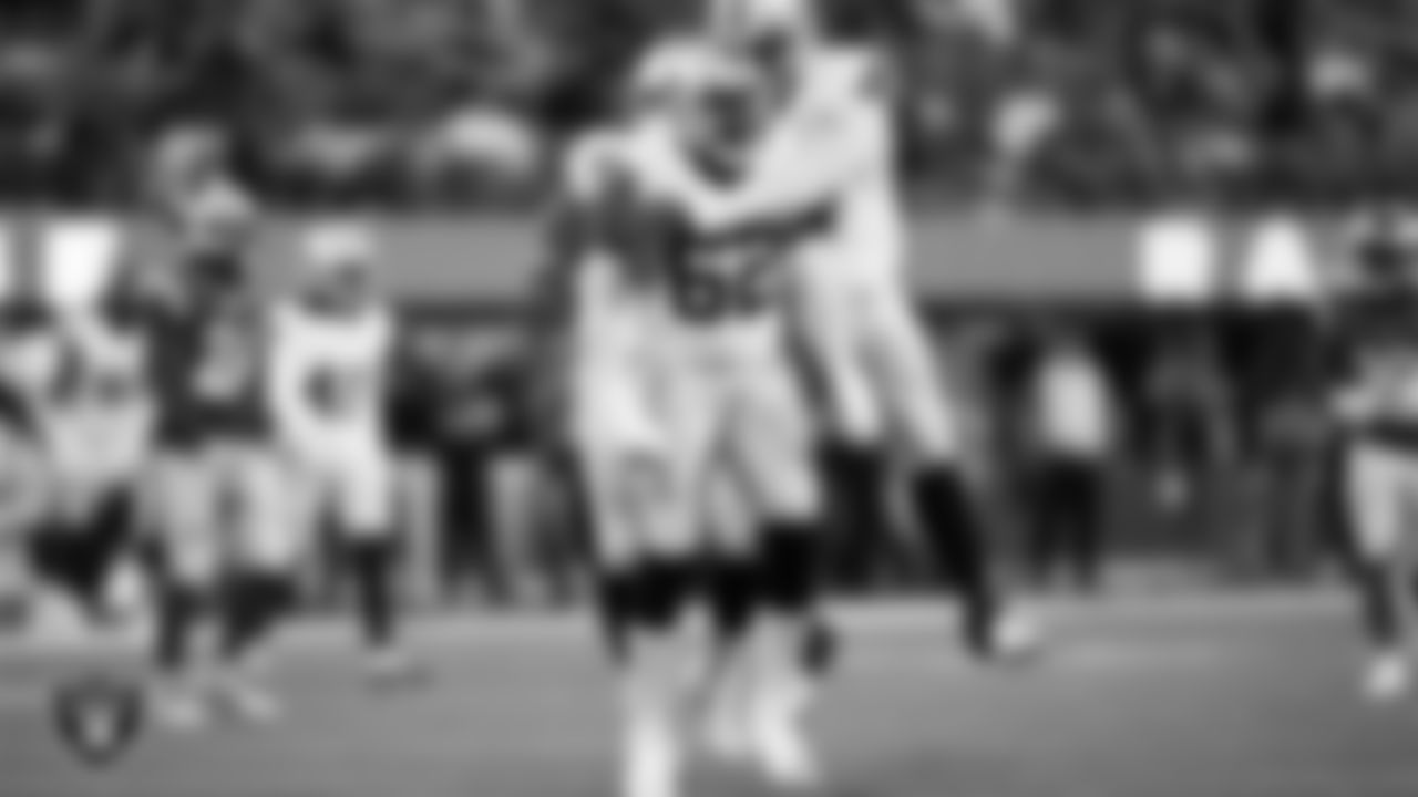 Las Vegas Raiders defensive lineman David Agoha (62) celebrates with defensive tackle Nesta Jade Silvera (97) after sacking the quarterback during the preseason away game against the Los Angeles Rams at Sofi Stadium.