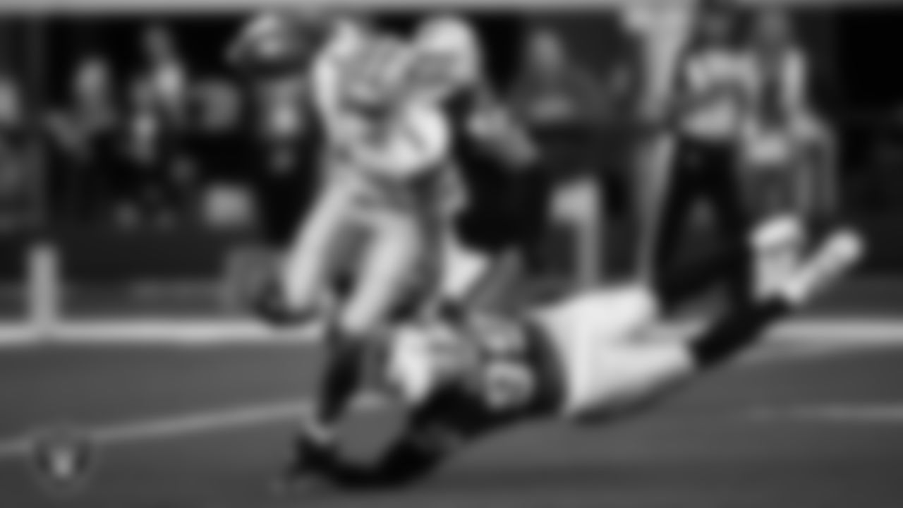Las Vegas Raiders defensive end Clelin Ferrell (99) makes a tackle during the regular season away game against the Dallas Cowboys.