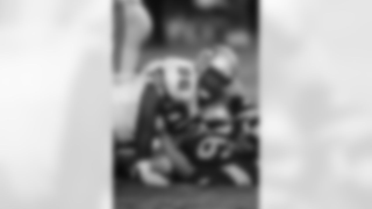 Seattle Seahawks defensive tackle Cortez Kennedy (96) topples a St. Louts Rams quarterback (16) during a pre-season NFL football game in 1991. (Al Messerschmidt via AP)