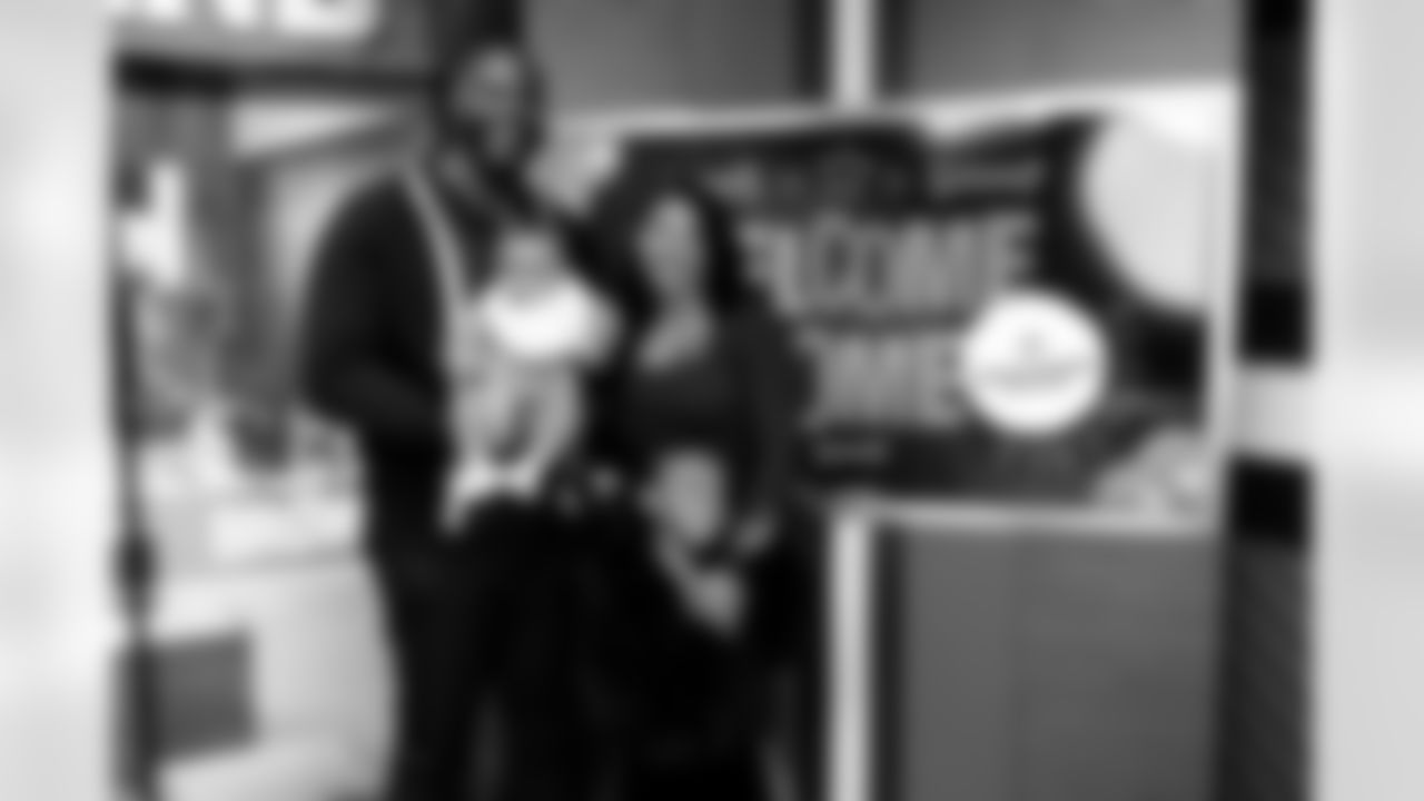 Offensive tackle Cornelius Lucas and his family visit CrossCountry Mortgage Campus on March 13, 2025.