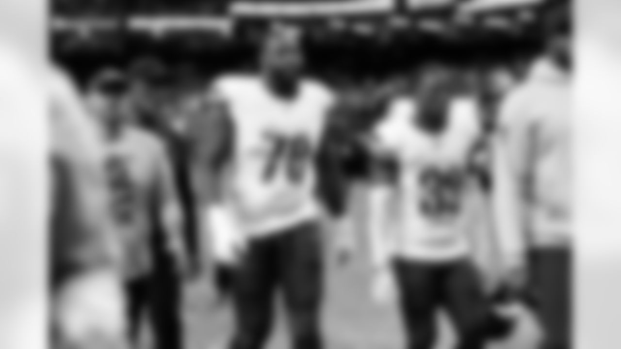 Washington Commanders offensive tackle Cornelius Lucas (78) warms up before an NFL football game against the New Orleans Saints, Sunday, Dec. 15, 2024, in New Orleans. (AP Photo/Tyler Kaufman)