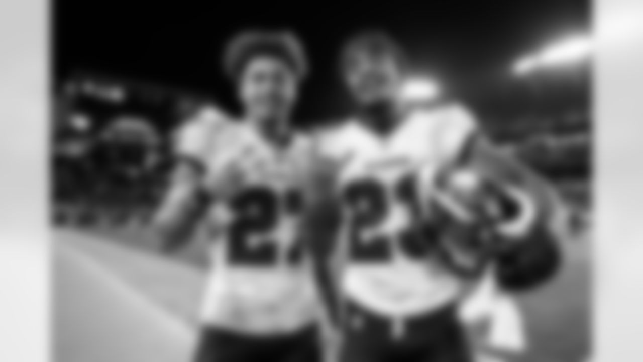TAMPA, FL - December 03, 2023 - Cornerback Zyon McCollum #27 and Safety Ryan Neal #23 of the Tampa Bay Buccaneers after the game between the Carolina Panthers and Tampa Bay Buccaneers. The Bucs won the game, 21-18. Photo By Doug DeFelice/Tampa Bay Buccaneers