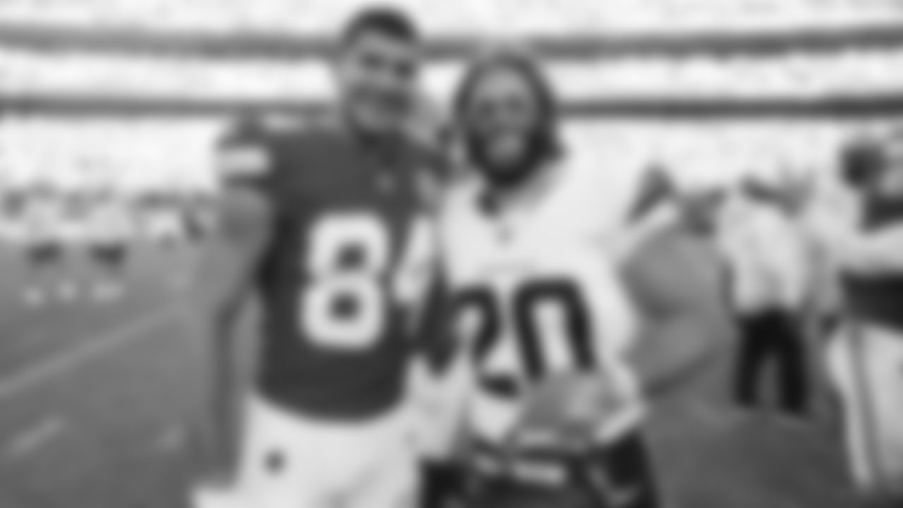 Kansas City Chiefs wide receiver Justin Watson (84) poses with Michael Burton following the Week 10 NFL Game against the Denver Broncos on Sunday, November 10, 2024.