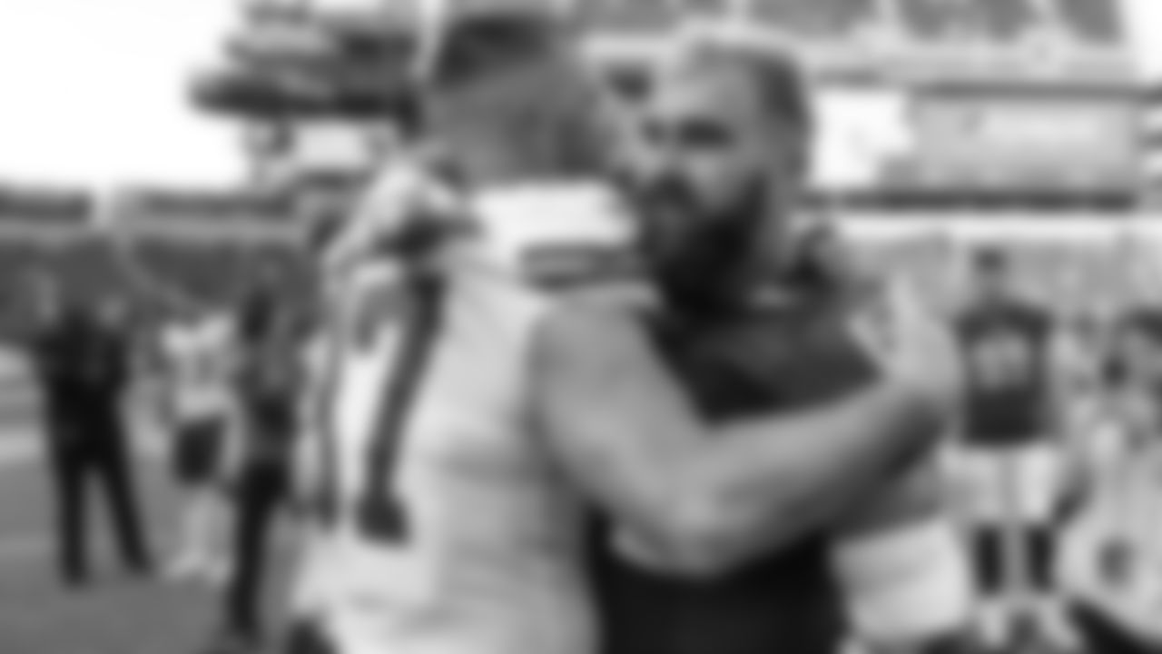 Kansas City Chiefs tight end Travis Kelce (87) and his brother Philadelphia Eagles center Jason Kelce (62) hug after an NFL football game against the Philadelphia Eagles, Sunday, October 3, 2021 in Philadelphia.