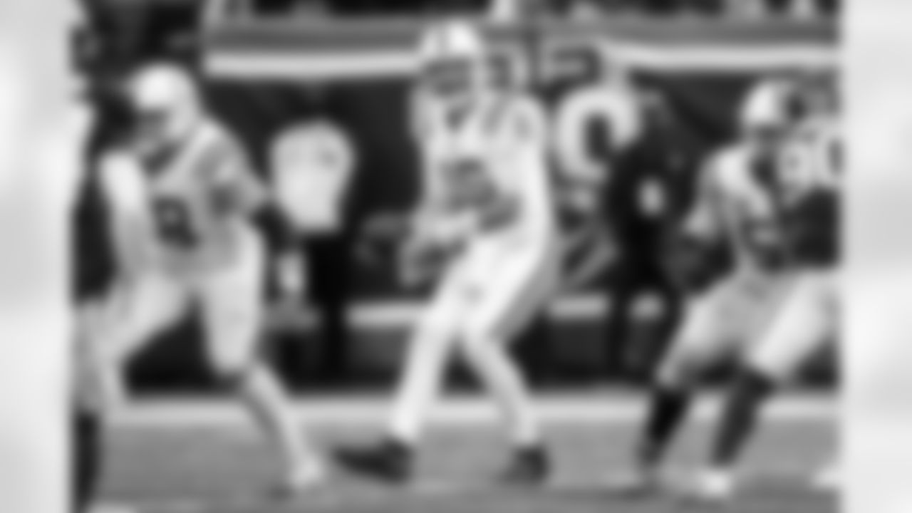 C Ryan Kelly #78, QB Joe Flacco #15 and G Quenton Nelson #56