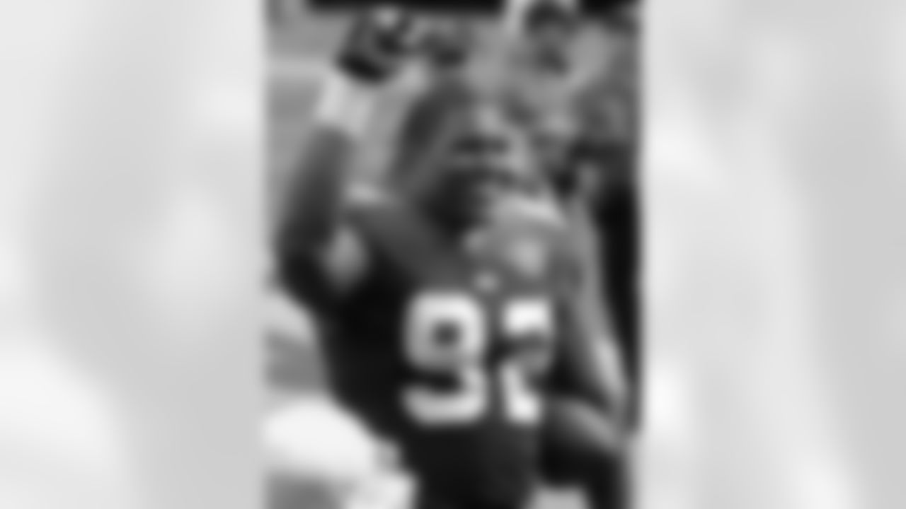 New York Giants defensive end Michael Strahan celebrates as he carries the ball off the field after beatint the Cleveland Browns, 27-10, Sunday, Sept. 26, 2004, at Giants Stadium in East Rutherford. (AP Photo/Bill Kostroun)