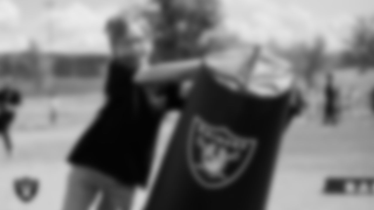 A student goes through a drill during a Raiders Junior Training Camp at Ulis Newton Elementary School.