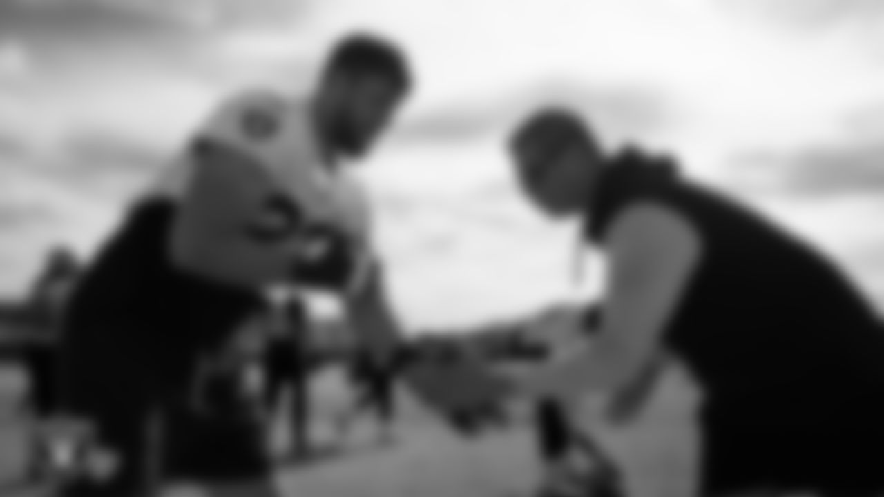 Las Vegas Raiders tackle Kolton Miller (74) and head strength and conditioning coach A.J. Neibel during practice at Intermountain Health Performance Center.