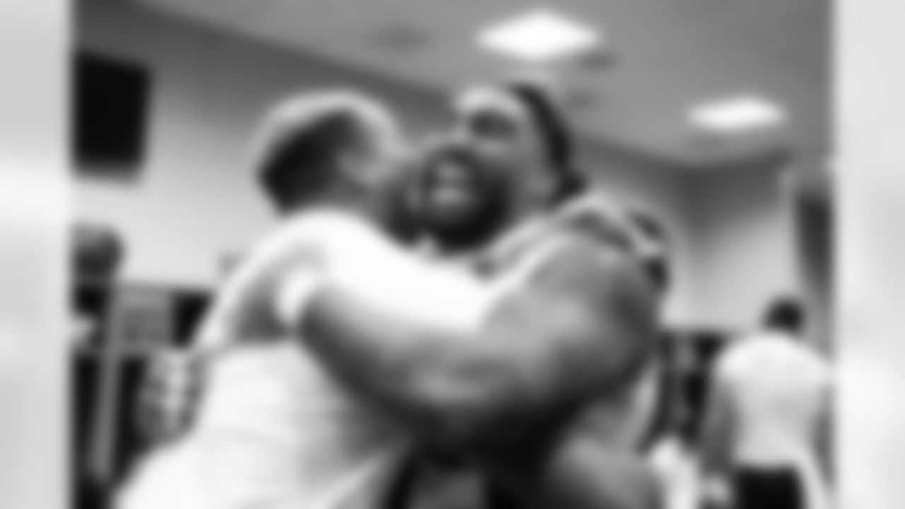 Seahawks Leonard Williams and Pharaoh Brown celebrate in the locker room after the victory.