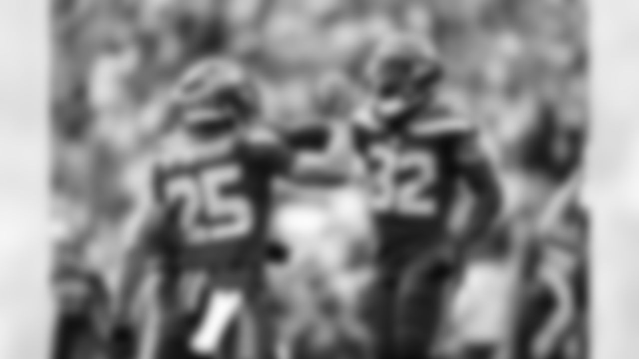 Seahawks running back Kenny McIntosh (25) and Seahawks free safety Jerrick Reed II (32) at the Week 8 matchup against the Buffalo Bills at Lumen Field on Sunday, October 27, 2024.
