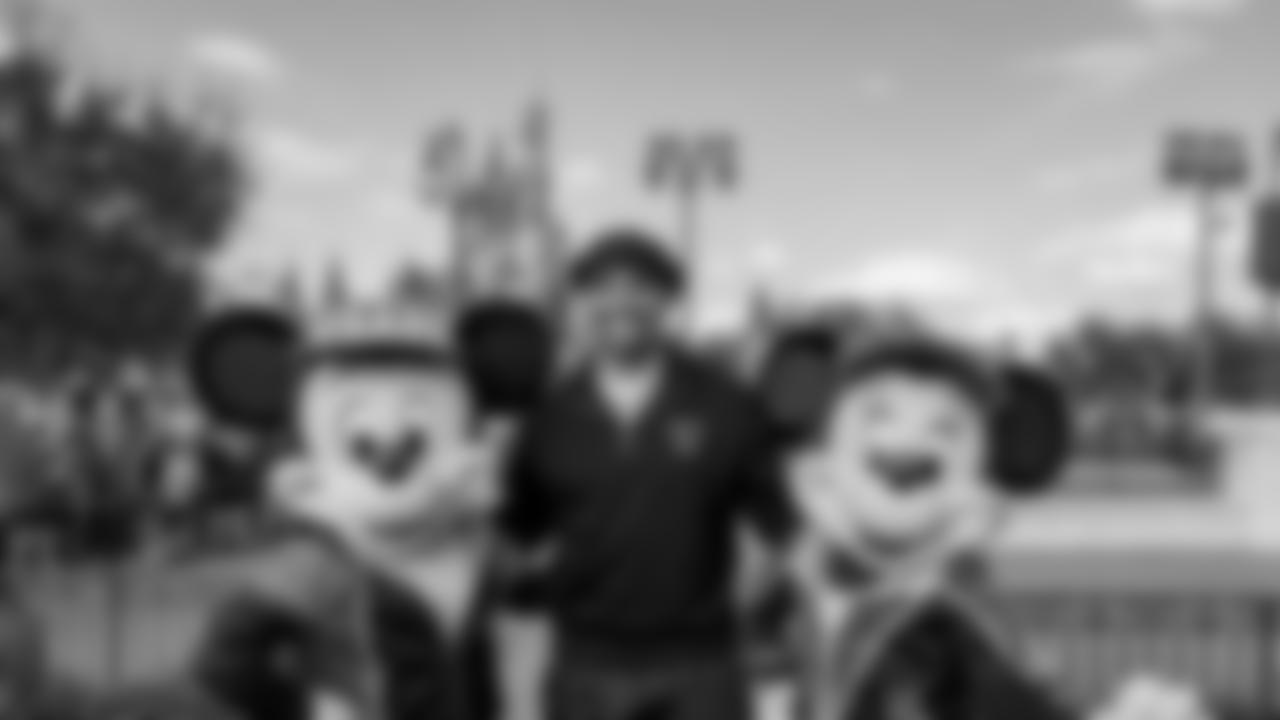 Minnie Mouse, Jalen Hurts, and Mickey Mouse